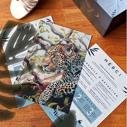 Thank-you card illustrated with a leopard for the vegan fashion brand Minuit sur Terre, placed near a shoe box